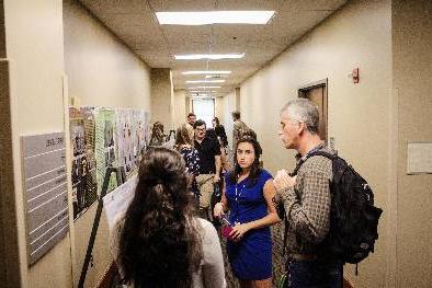 Students discussing research posters